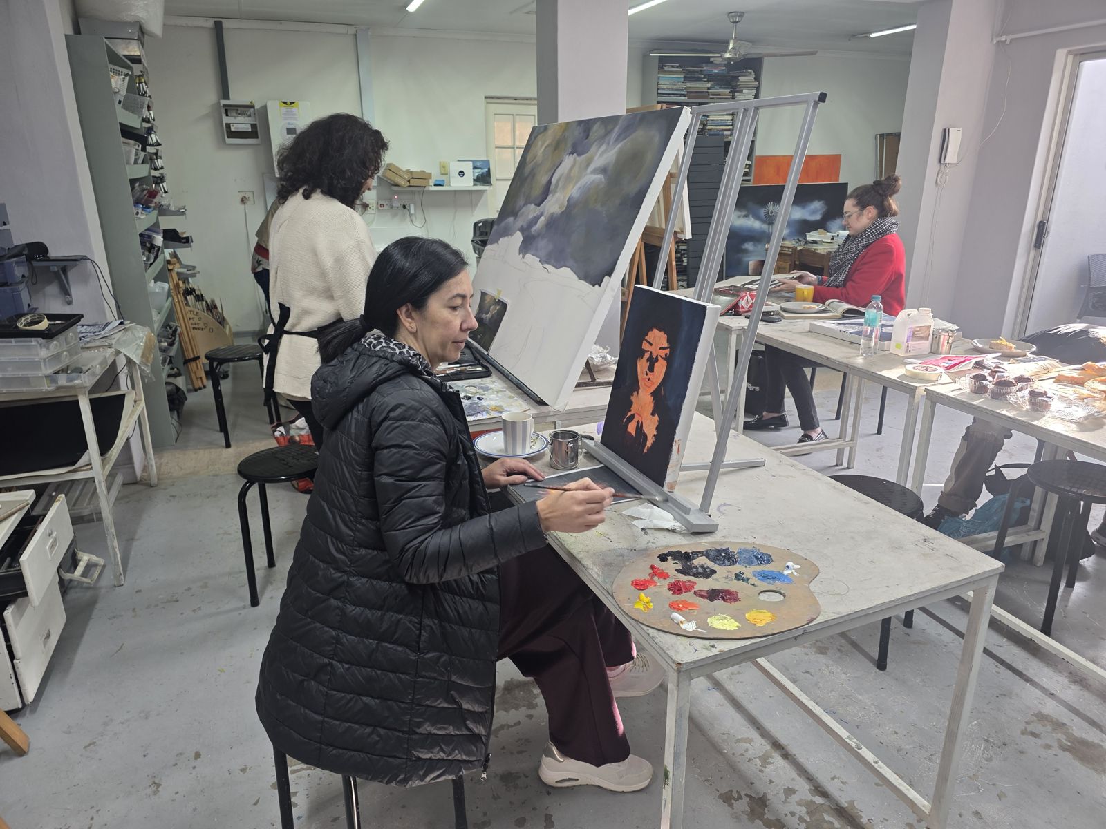 Student painting a portrait